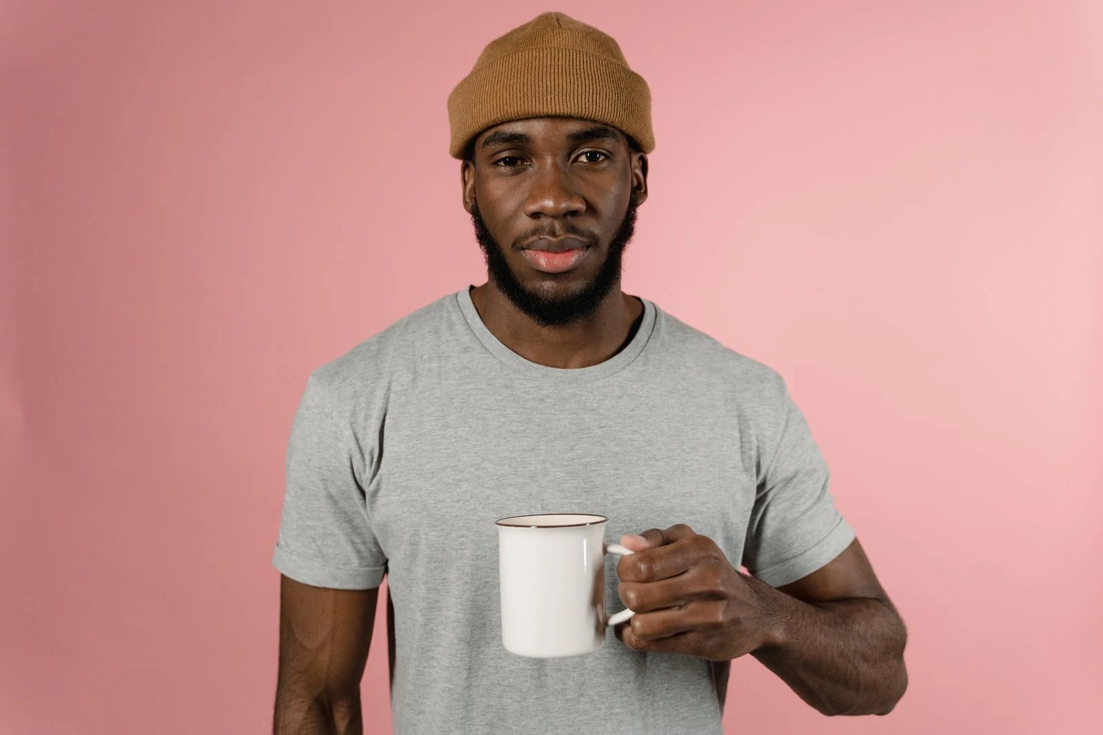 A man holding a white mug, the source photograph for the Wan Pro video test