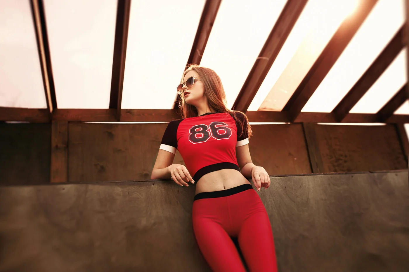 A woman wearing red sportswear, the source photograph for a Wan video example